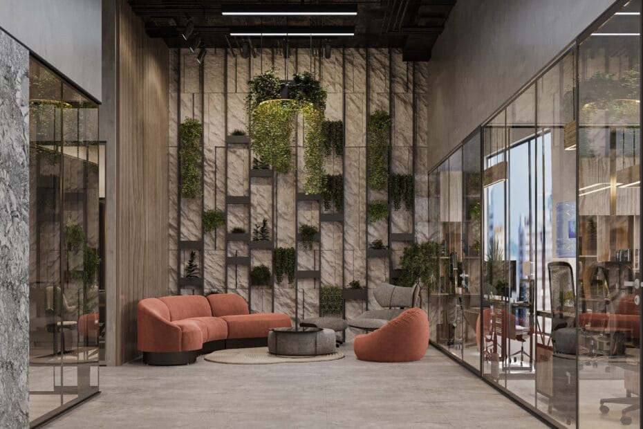 Un espace détente contemporain avec un canapé en velours terracotta, un fauteuil lounge et un mur végétalisé design. Le tout est entouré de bureaux vitrés dans un intérieur industriel chic.